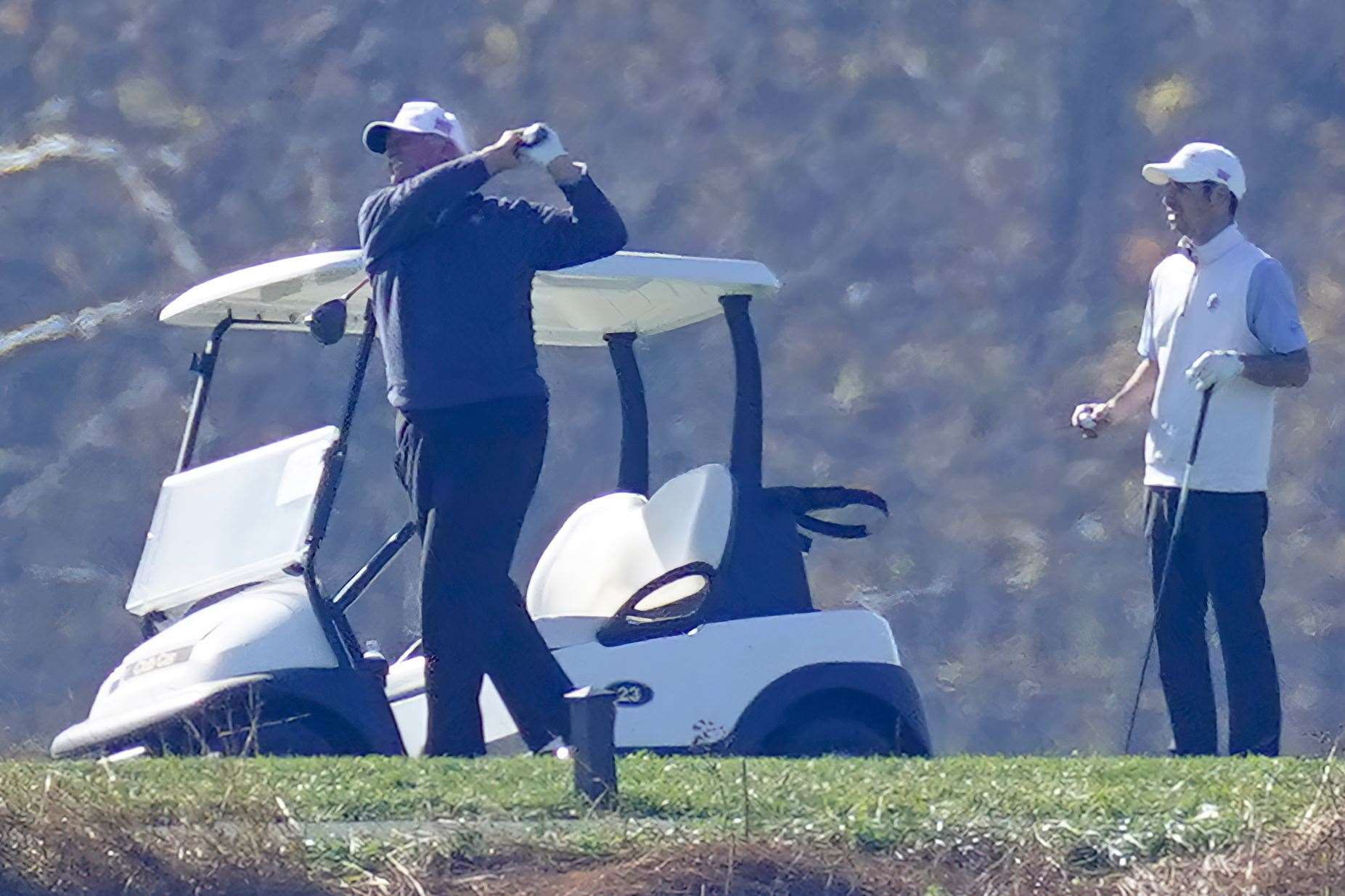 President Donald Trump plays a round of Golf at the Trump National Golf Club in Sterling, Virginia (Steve Helber/AP)