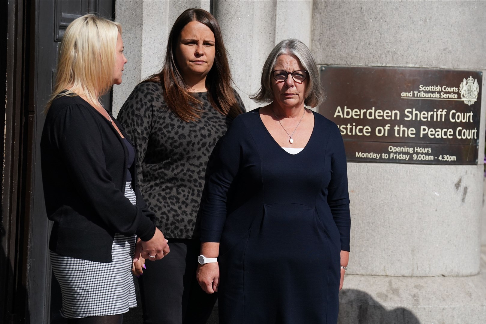 Diane Stuchbury, right, and family members outside the High Court in Aberdeen (Andrew Milligan/PA)