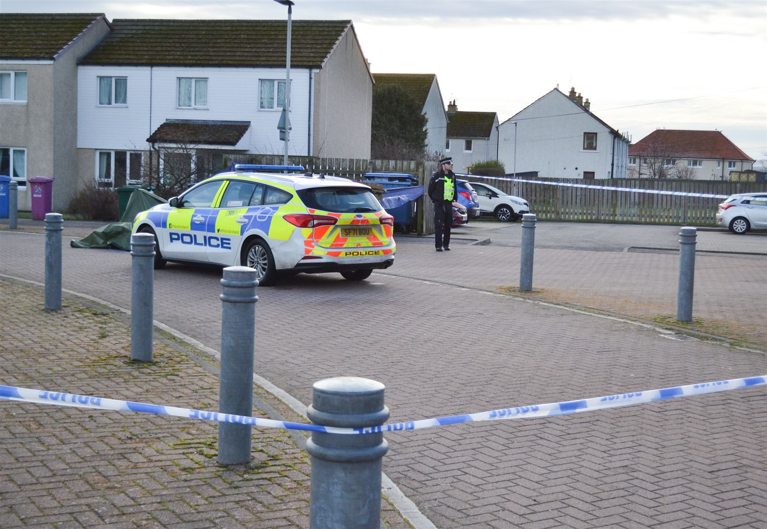 Police remain on the scene after an incident at St Margaret's Crescent in Lossiemouth. Picture: Tyler McNeil