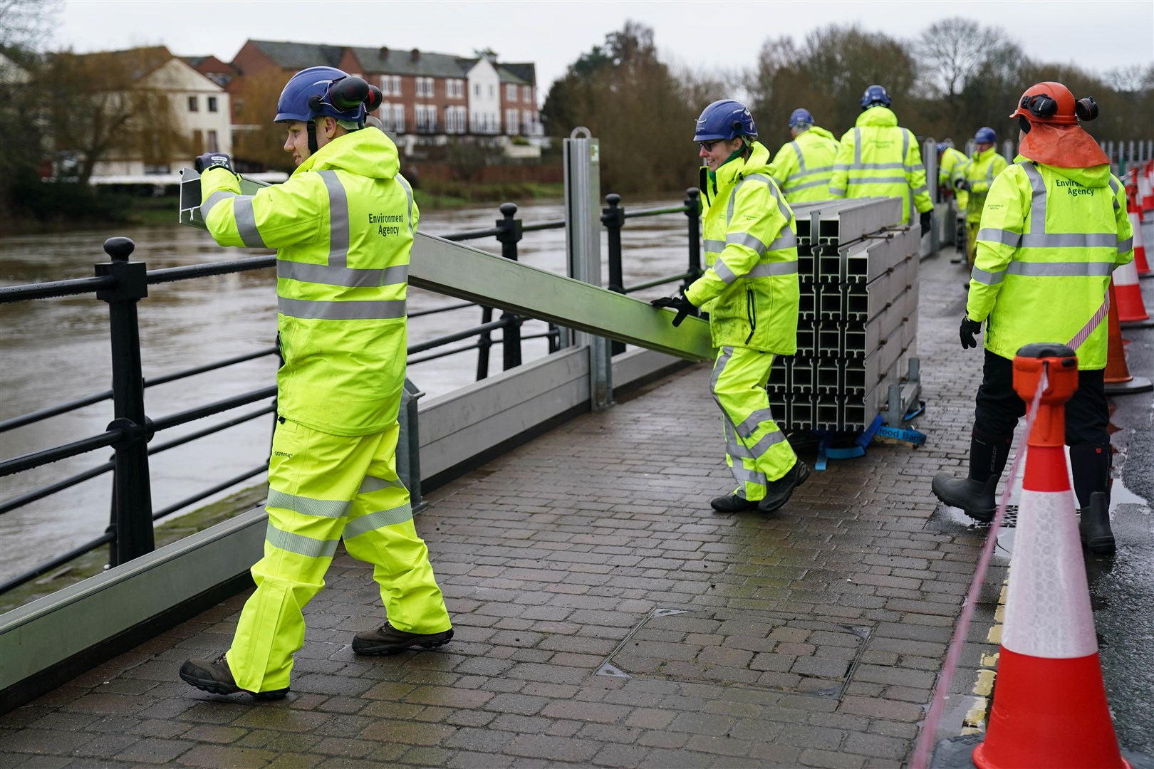 Workers from the Environment Agency installing flood defences in Bewdley, Worcestershire (Jacob King/PA)