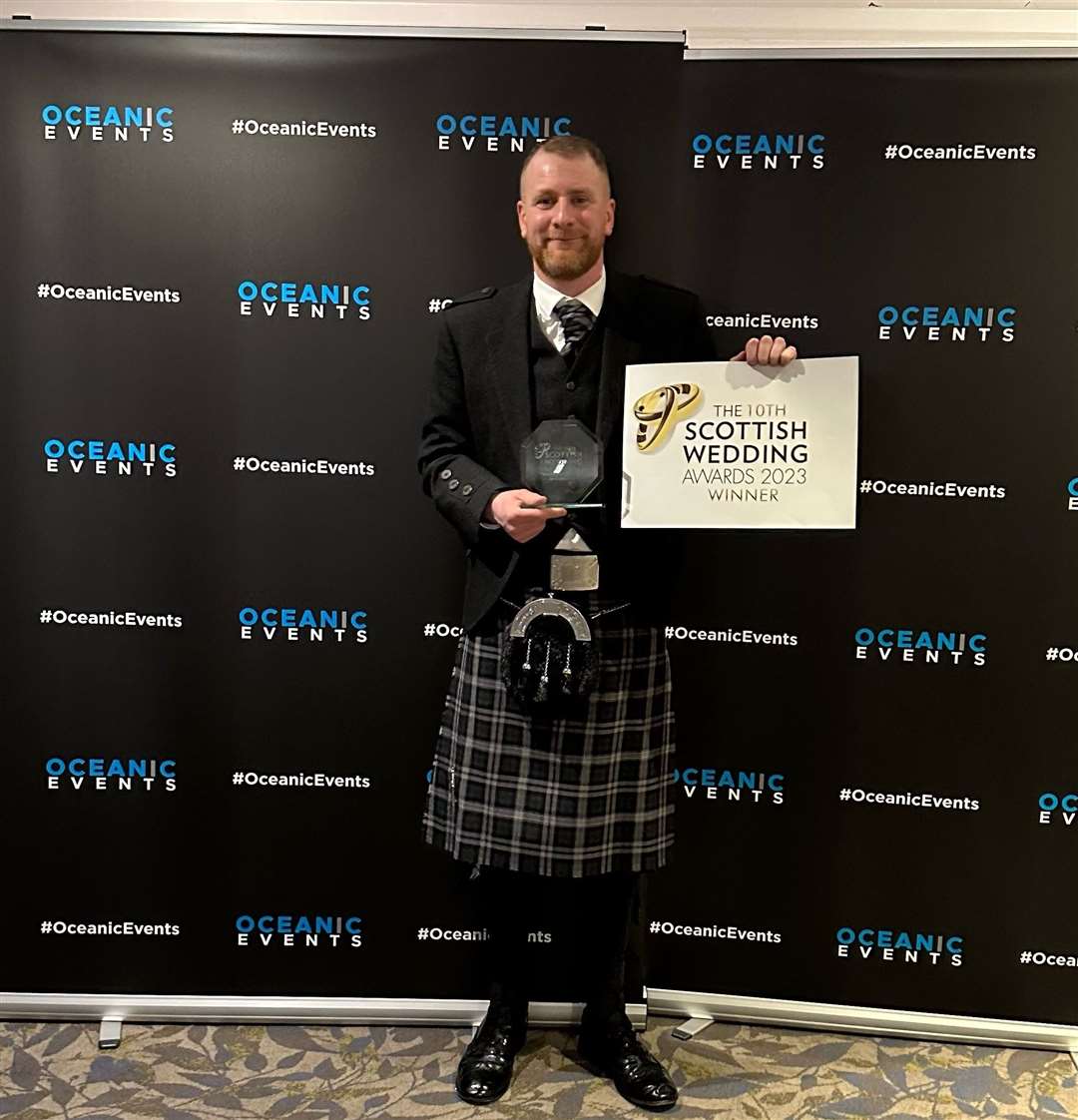 Paul T proudly shows off his Scottish Wedding Awards trophy. Picture: Paul Tough