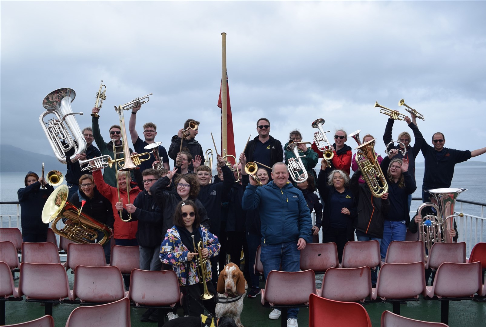 Moray Concert Brass performing on the ferry to Mull during a tour.
