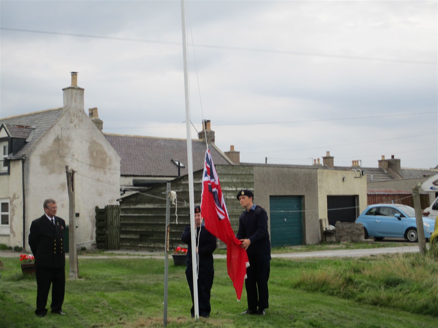 Moray Sea Cadets raise 'The Red Duster'.