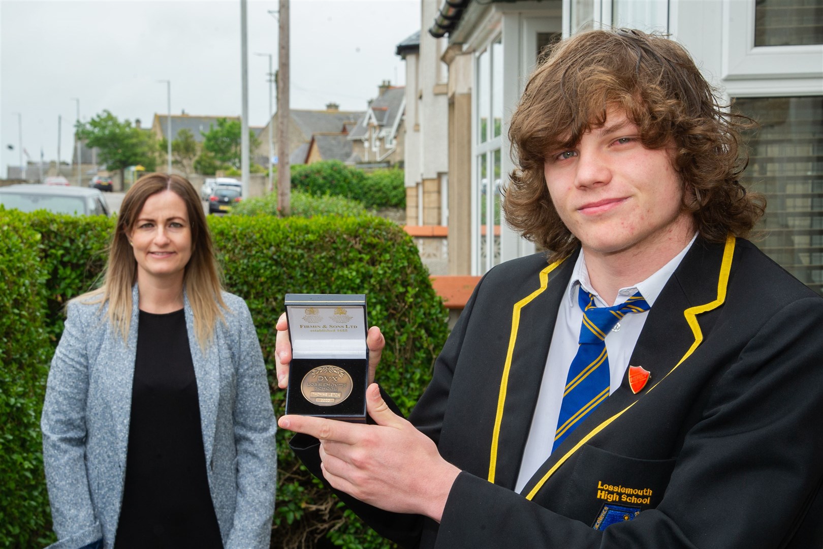 Lossiemouth High School dux Thomas Letch with acting deputy head teacher Louise Petrie. Picture: Daniel Forsyth.
