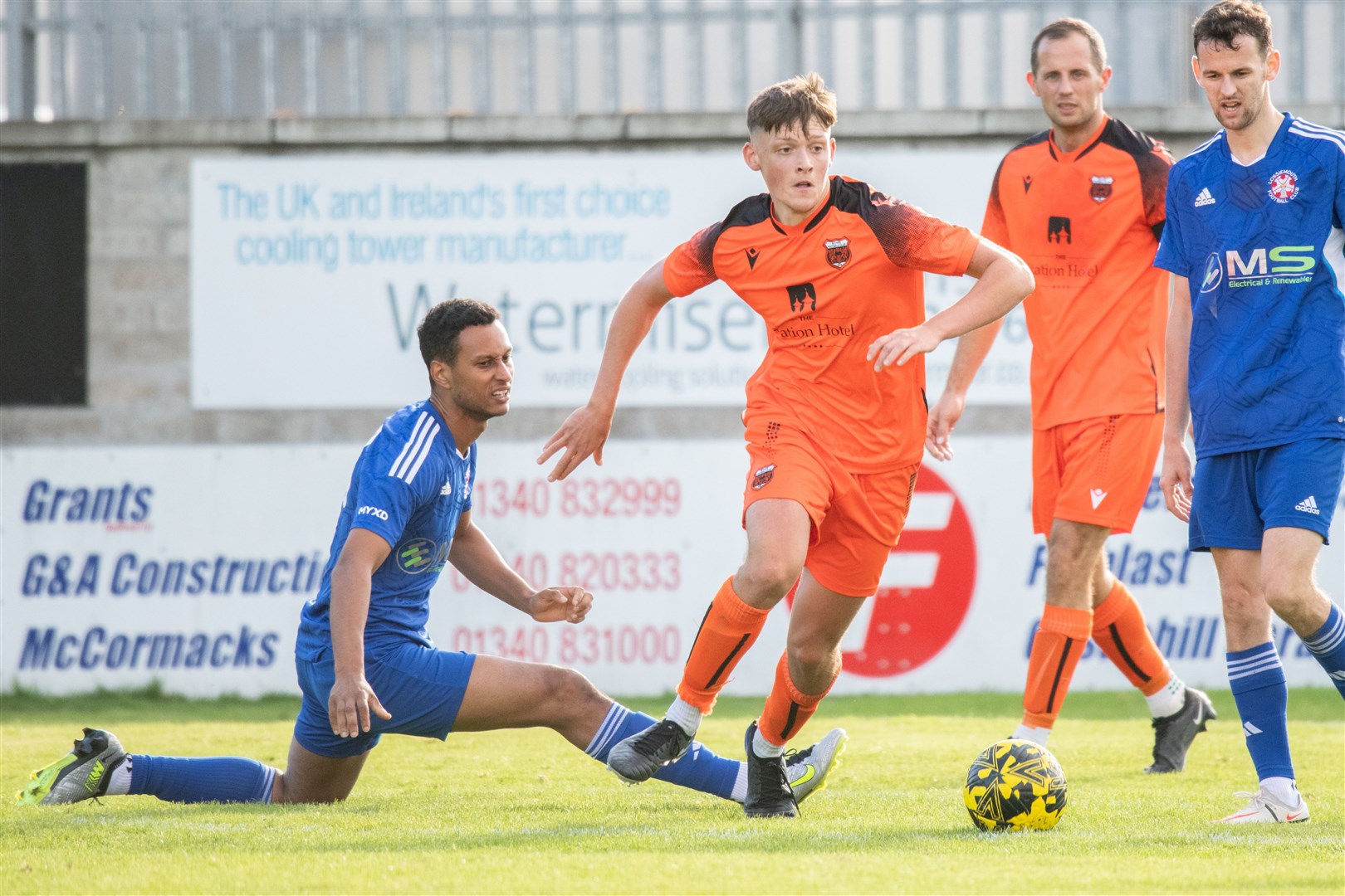 Rothes' Callum Haspell evades a challenge from Lossie forward Fraser Forbes. Picture: Daniel Forsyth
