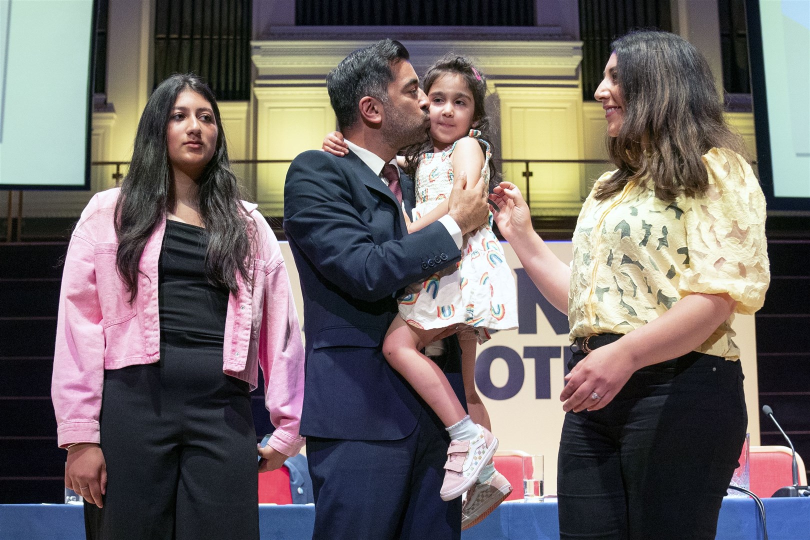 First Minister Humza Yousaf with wife Nadia, daughter Amal and stepdaughter Maya (left) on stage after his speech at the SNP independence convention at Caird Hall in Dundee (Jane Barlow/PA)