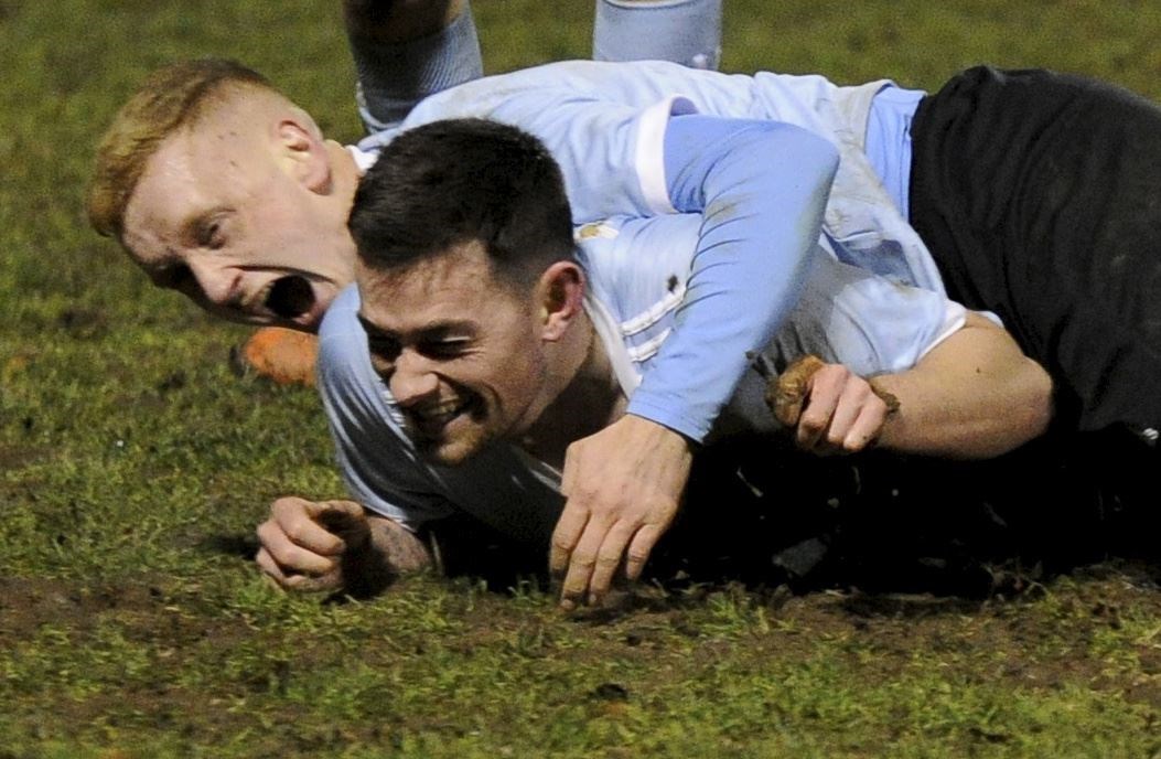 Colin Charlesworth is mobbed by then team-mate Harry Noble after scoring against Huntly for Deveronvale.