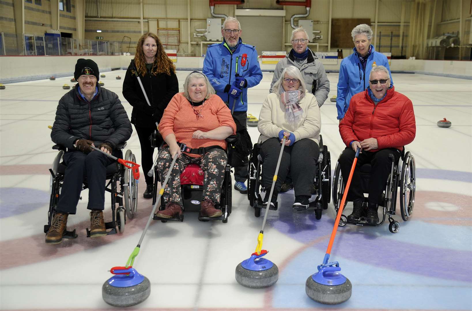 The newly accessorised Wheelies and Feeties curling team, front (from left) Paul Wright, Dot Cameron, Lynne Russell and Jim Gault. Back row: Nicole Allan, Colin McGrath, Billy Cormack and club coach Sandra MacIver.  Picture: Becky Saunderson