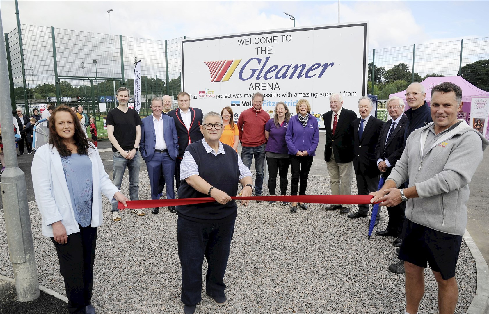 Jane Scott, granddaughter of the founder of Gleaner Oils (and current owner with her husband Stephen), Tiger Porter of Elgin City youth cutting the ribbon and Dave Allen, chairman of the Elgin Sports Community Trust. Picture: Becky Saunderson.
