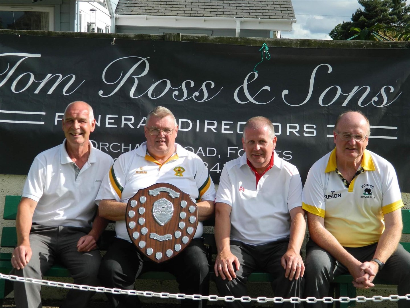 The winning trio, from left: George Steven, Allan Cameron and Scott McLean with Forres president Alex Porter.
