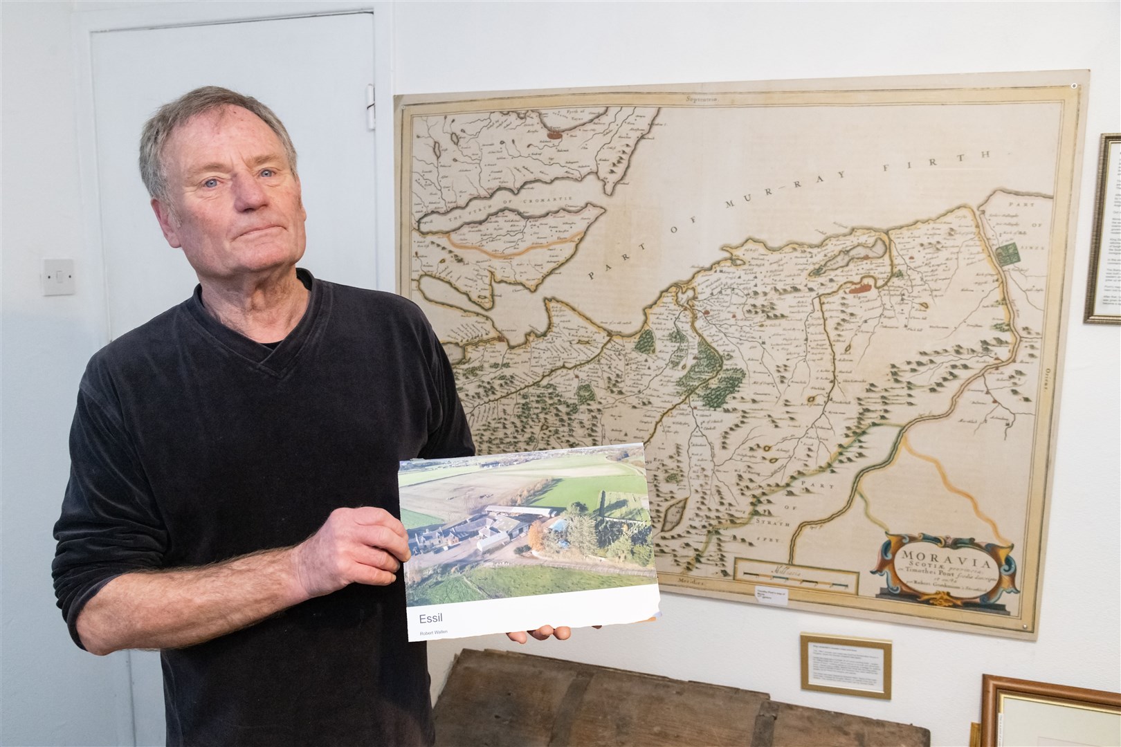 In front of an old map of the area. Picture: Beth Taylor.