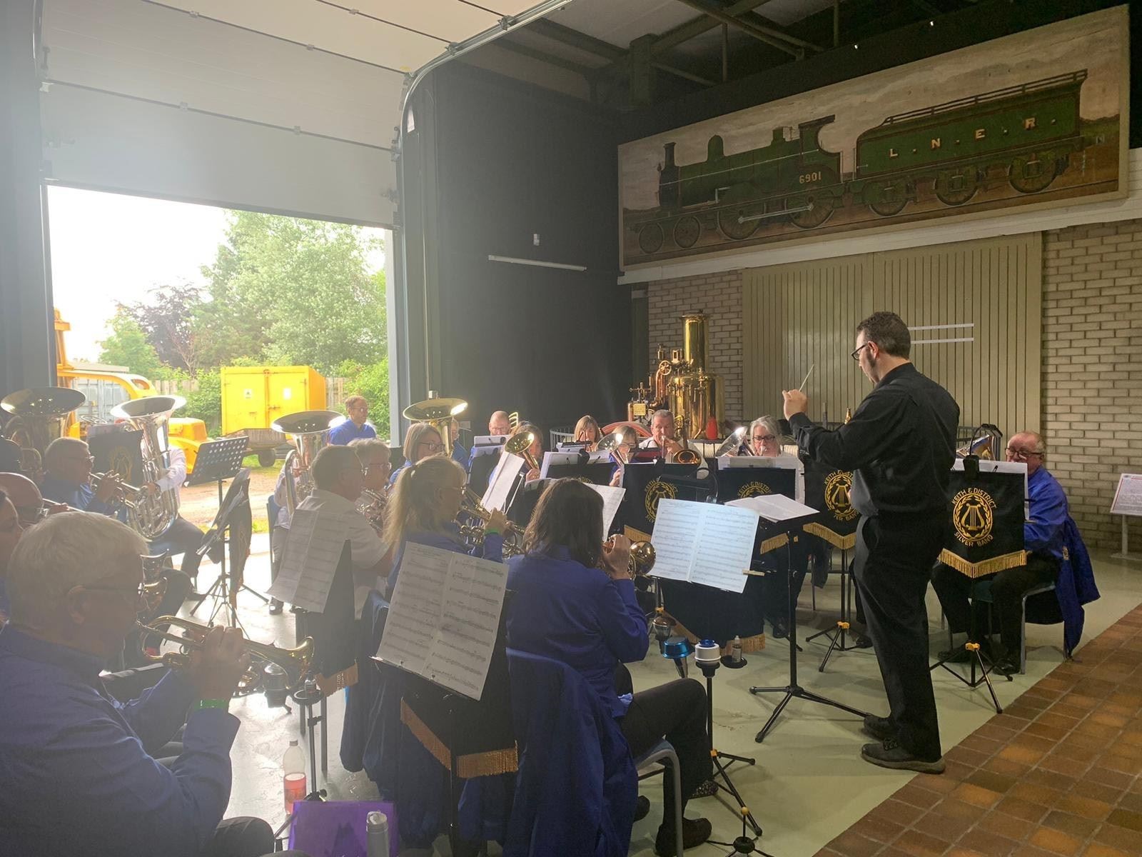 The band perform at the Grampian Transport Museum.