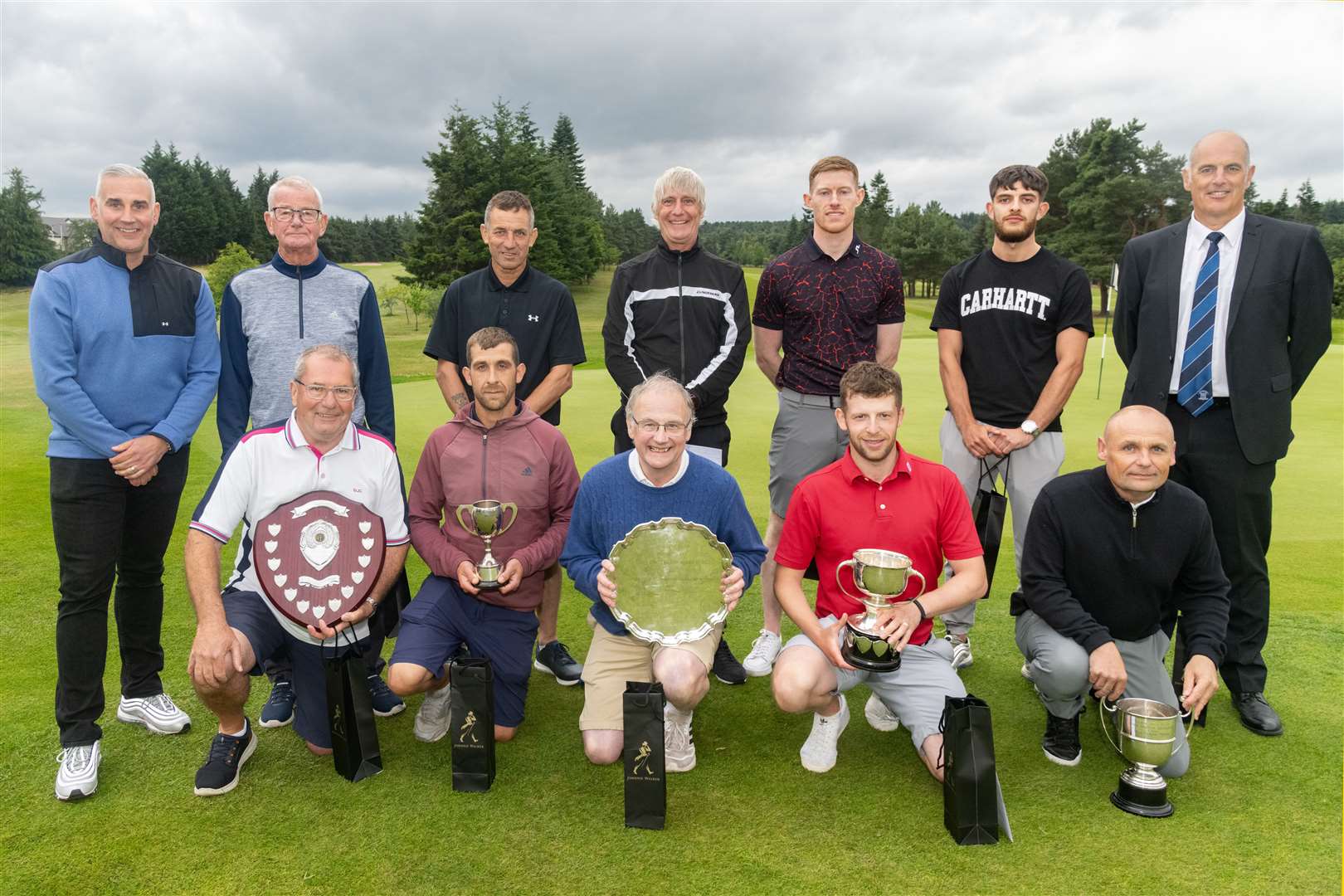 Sponsor Martin Grierson (left) and Club Captain Jock Royan (right) with the winners and runners-up at the Elgin Golf Club's Five-Day Open...Picture: Beth Taylor.