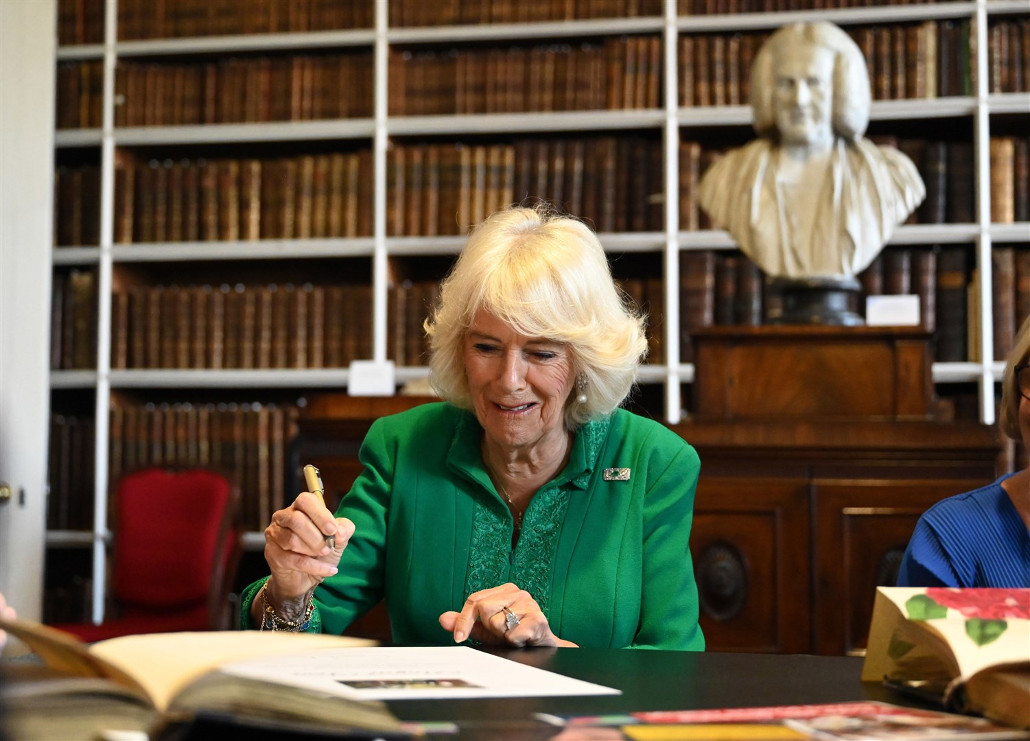 Camilla was shown Jonathan Swift’s annotated copy of his own book, Gulliver’s Travels (Michael Cooper/PA)