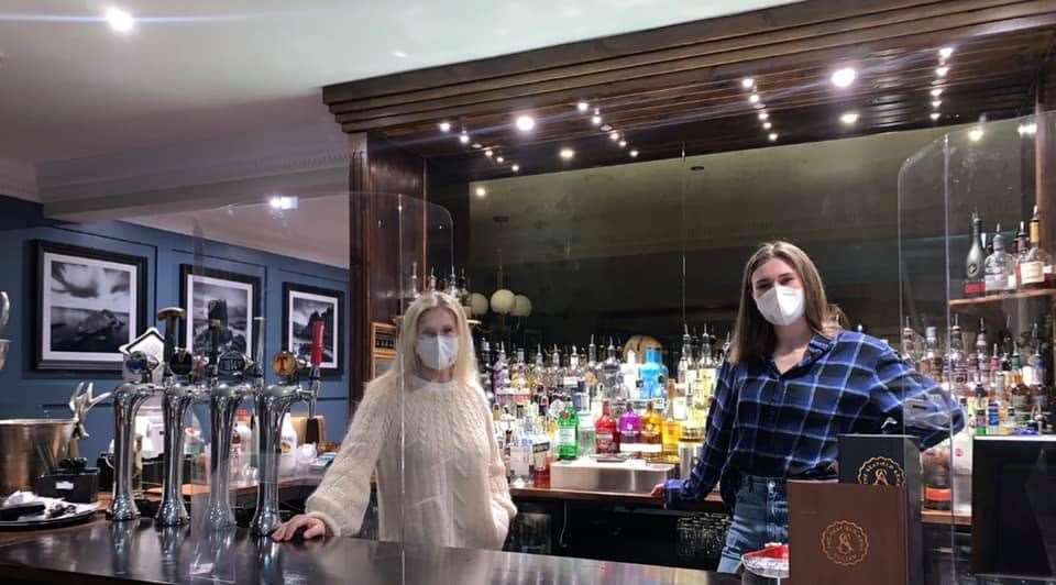 Alison McCosh (left) and Alison Todd take in the view from behind the bar during their stay at the Seafield Arms Hotel in Cullen.