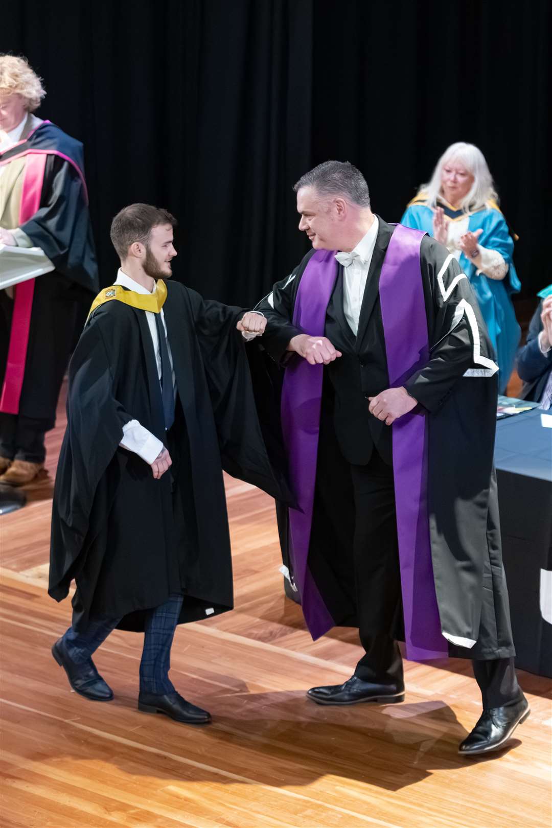 Professor Keith Smyth, Dean of Learning and Teaching, congratulating Jacob Lee Buchan. ..UHI Moray's Graduations at Elgin Town Hall...Picture: Beth Taylor.
