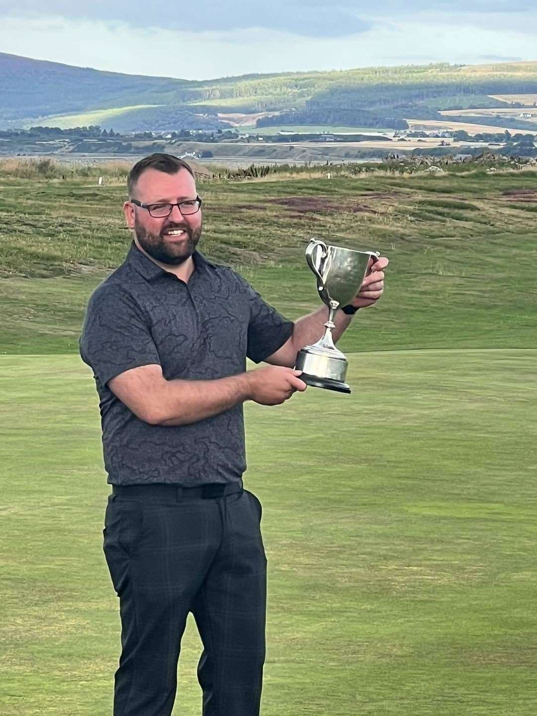 Feeling just champion is Scratch winner George Davidson. Picture: Spey Bay GC