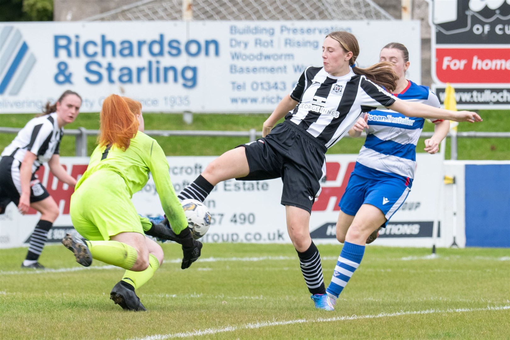 Elgin City's Darcy Matheson tries to knock the ball past Dyce keeper Faith Jessica Maan.Elgin City Women (5) vs Dyce Women FC (5) - SWFL North 2023/24 - Borough Briggs, Elgin 5/5/2024.Picture: Daniel Forsyth.