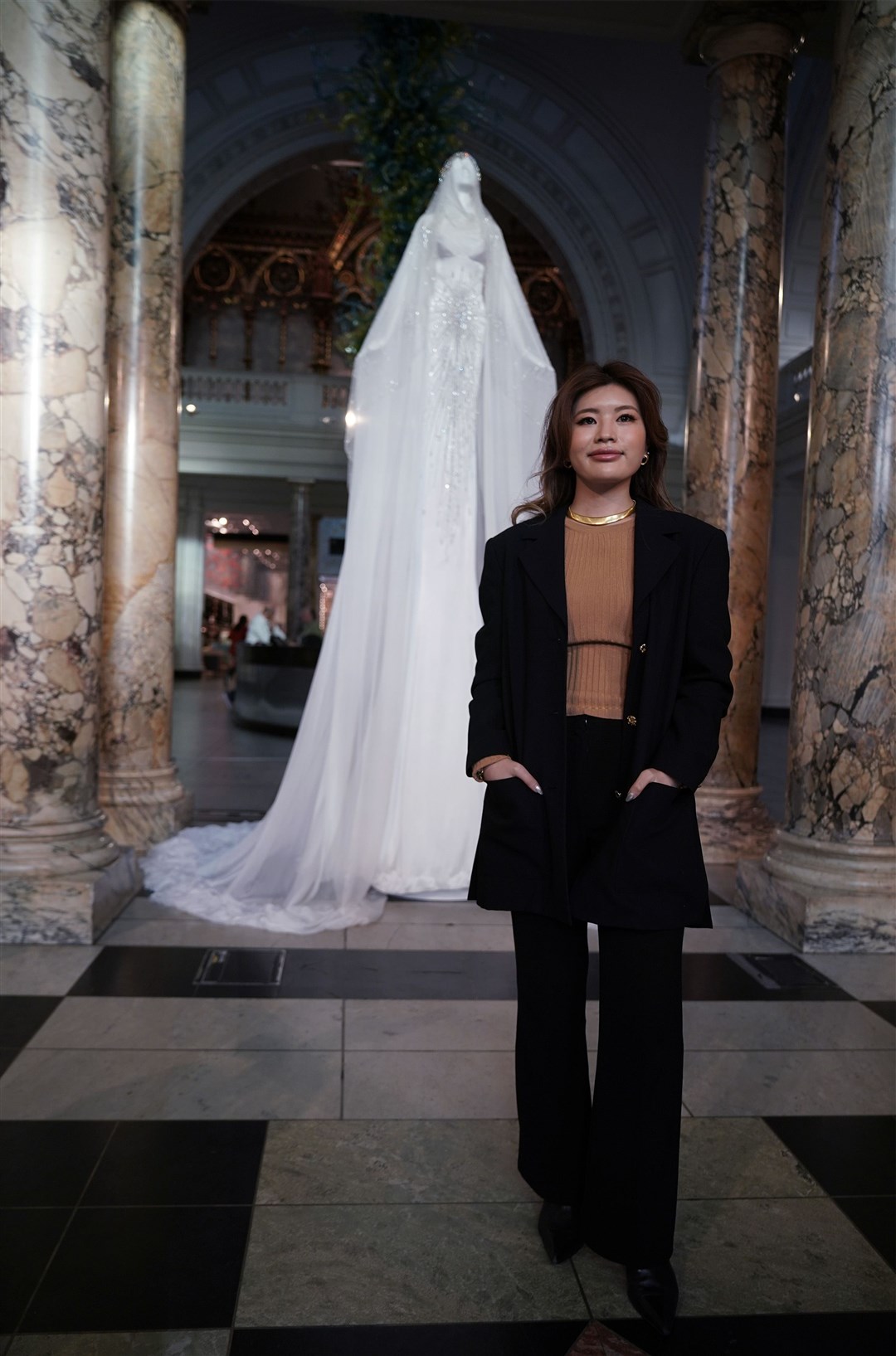 London-based Korean fashion designer Miss Sohee with her creation (Yui Mok/PA)