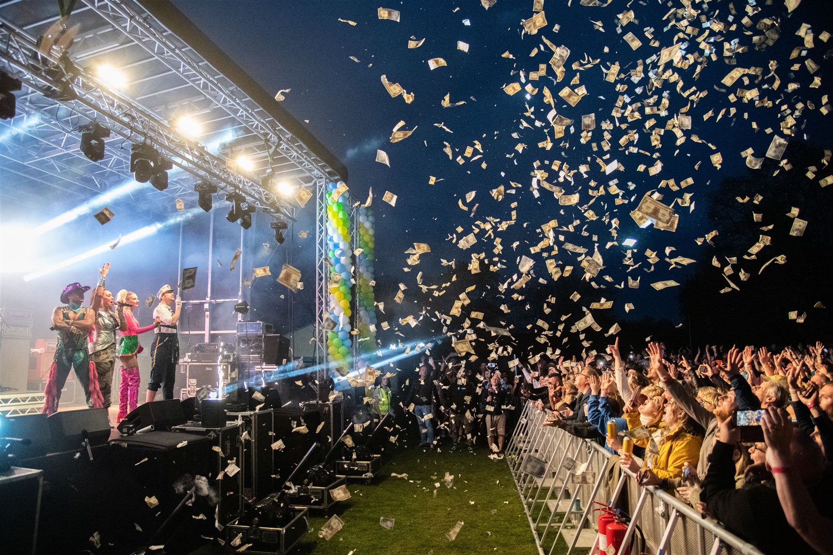 Vengaboys ended their set at MacMoray 2022 by firing Vengabucks into the crowd. Picture: Daniel Forsyth