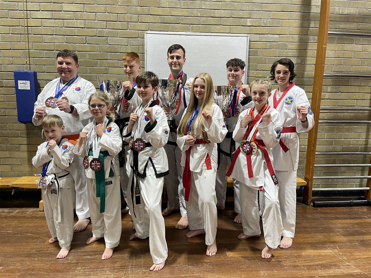 A team shot of the medal winners for DKMA Tang Soo Do.