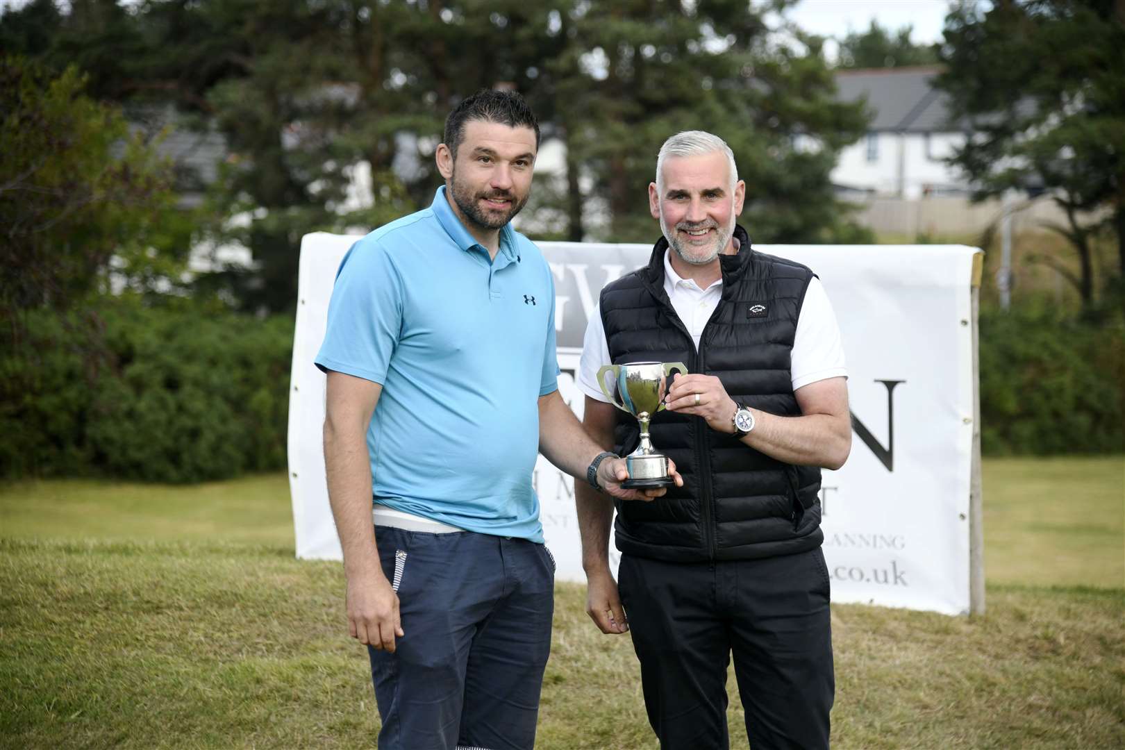 Craig Mills being presented with his trophy, JAG Innes Cup, by Martin Grierson...Elgin Five Day Open 2022...Picture: Beth Taylor.