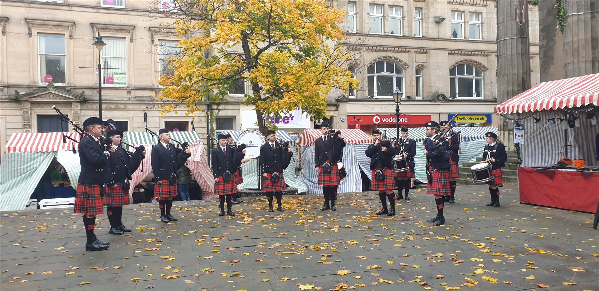 Elgin and District Pipe Band playing on the Plainstones.