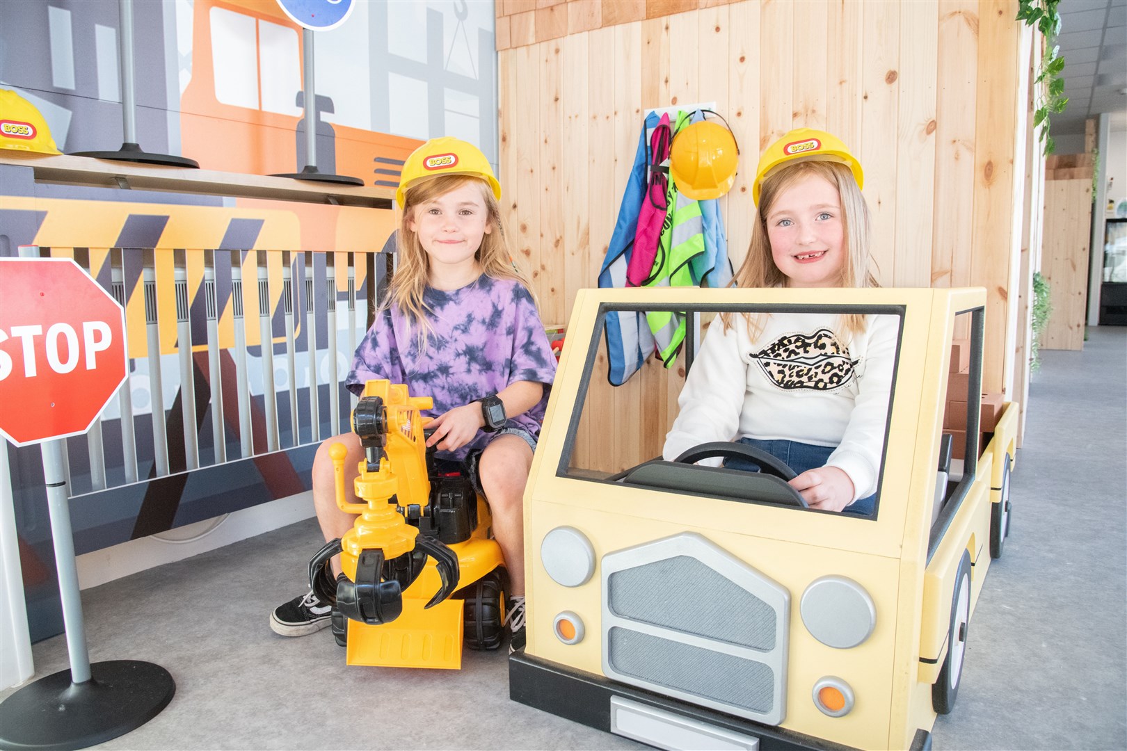 Poppy Larkworthy (left) and Chloe Main have fun in the construction site. Picture: Daniel Forsyth