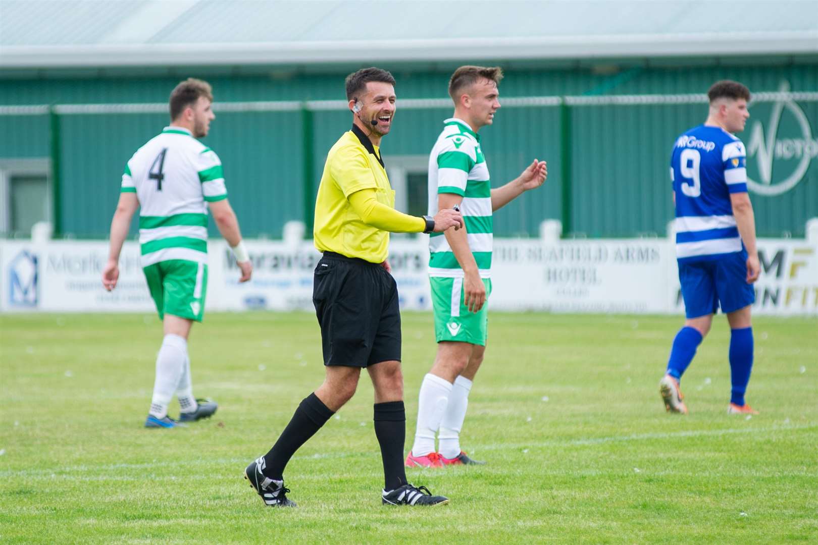Kevin Buchanan enjoys a lighter moment while refereeing a Buckie Thistle match..Picture: Daniel Forsyth..