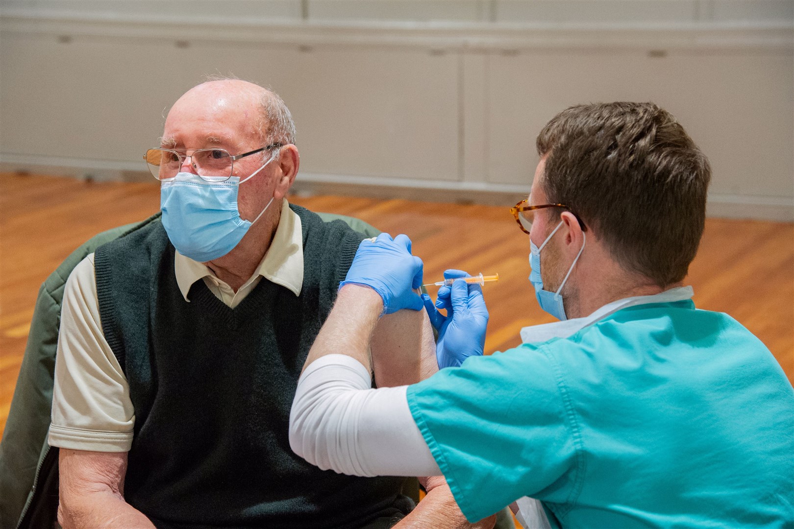 Advanced Nurse Practitioner Grant Redford gives Ian Shepherd the vaccine at the Fochabers Public Institut. Picture: Daniel Forsyth