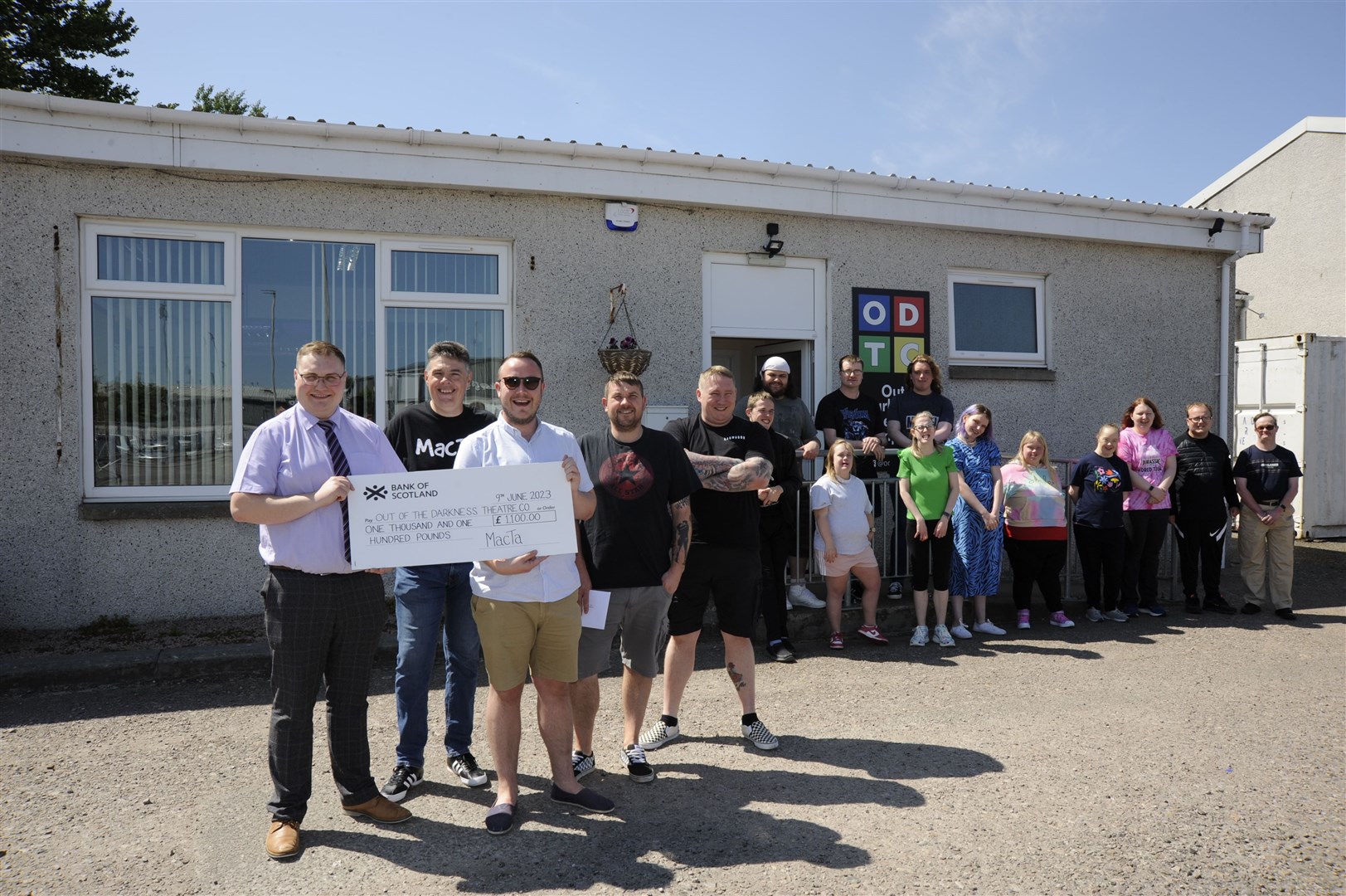 Local band MacTa visited Out of the Darkness Theatre company to present them a cheque for £1100.