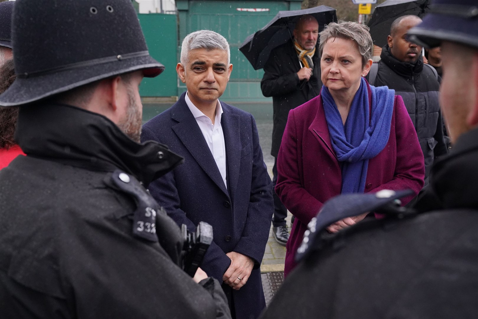 Mayor of London Sadiq Khan and shadow home secretary Yvette Cooper speak with police officers during a visit to Earlsfield police station (Jonathan Brady/PA)