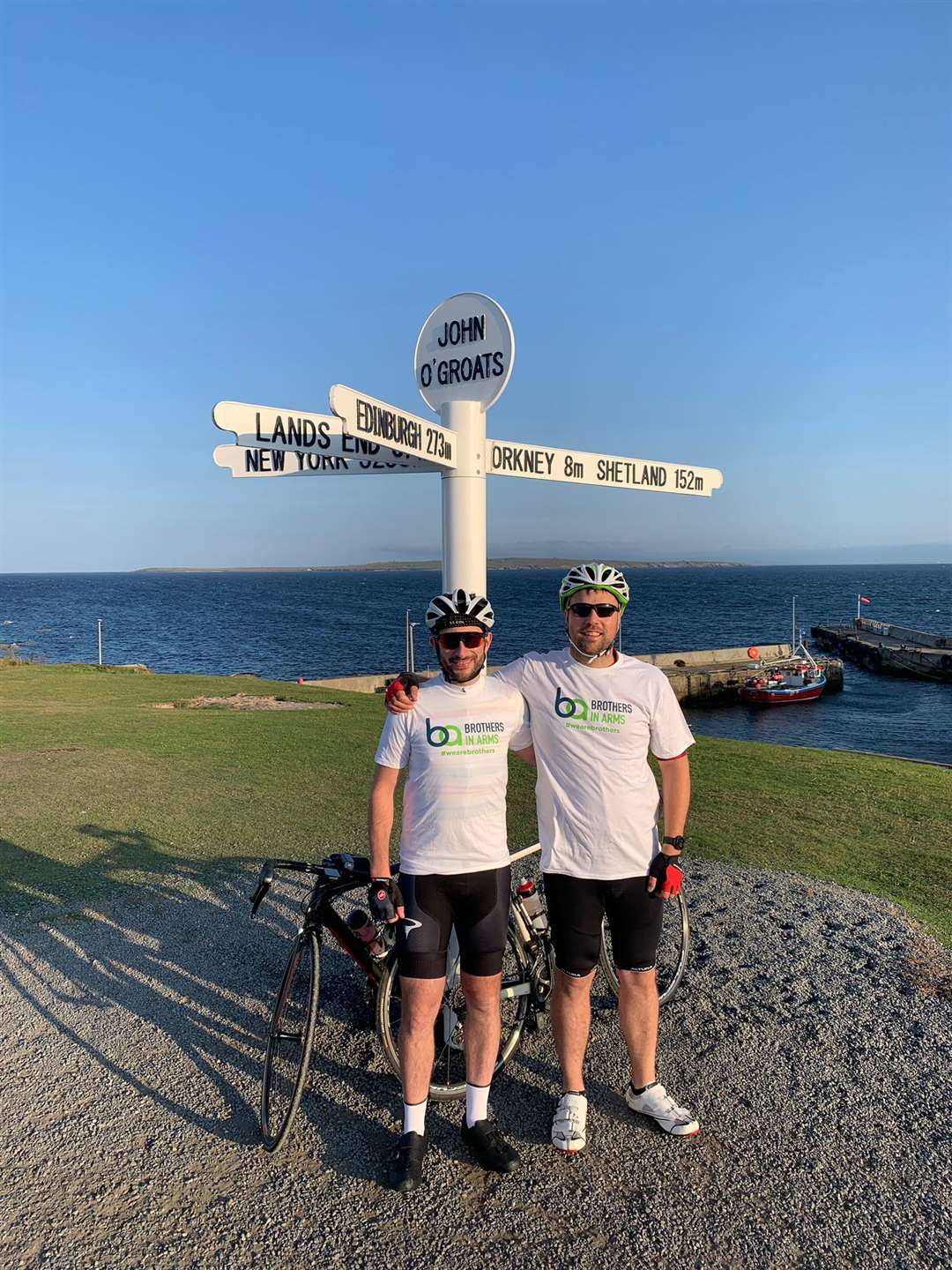 Charity cyclists Ian Johnston and Jamie Ritchie at John o' Groats on Wednesday morning.