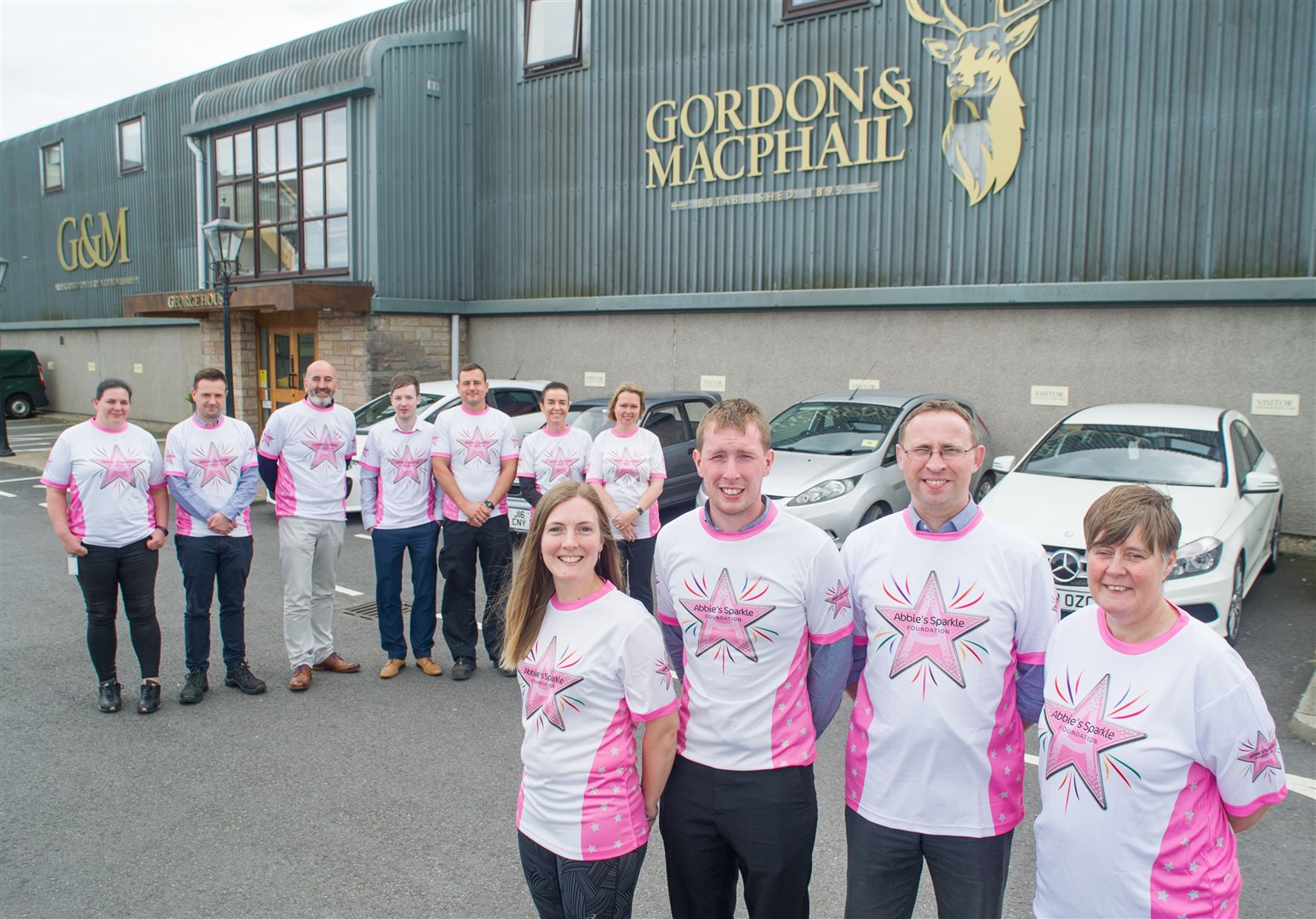 Gordon and Macphail's managing director Ewen Mackintosh (back third left) and a team of colleagues are preparing to take on Ben Nevis as part of their fundraising efforts for Abbie's Sparkle Foundation. Picture: Becky Saunderson. Image No.044653.