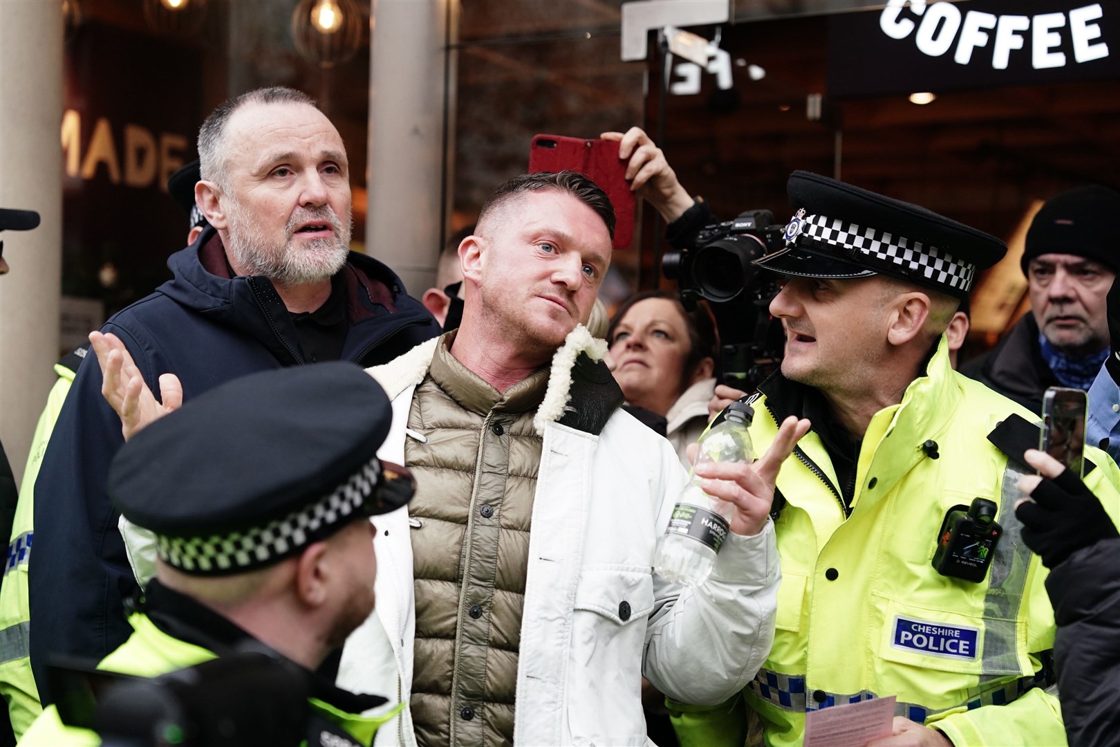 Tommy Robinson was escorted away from the march (Jordan Pettitt/PA)