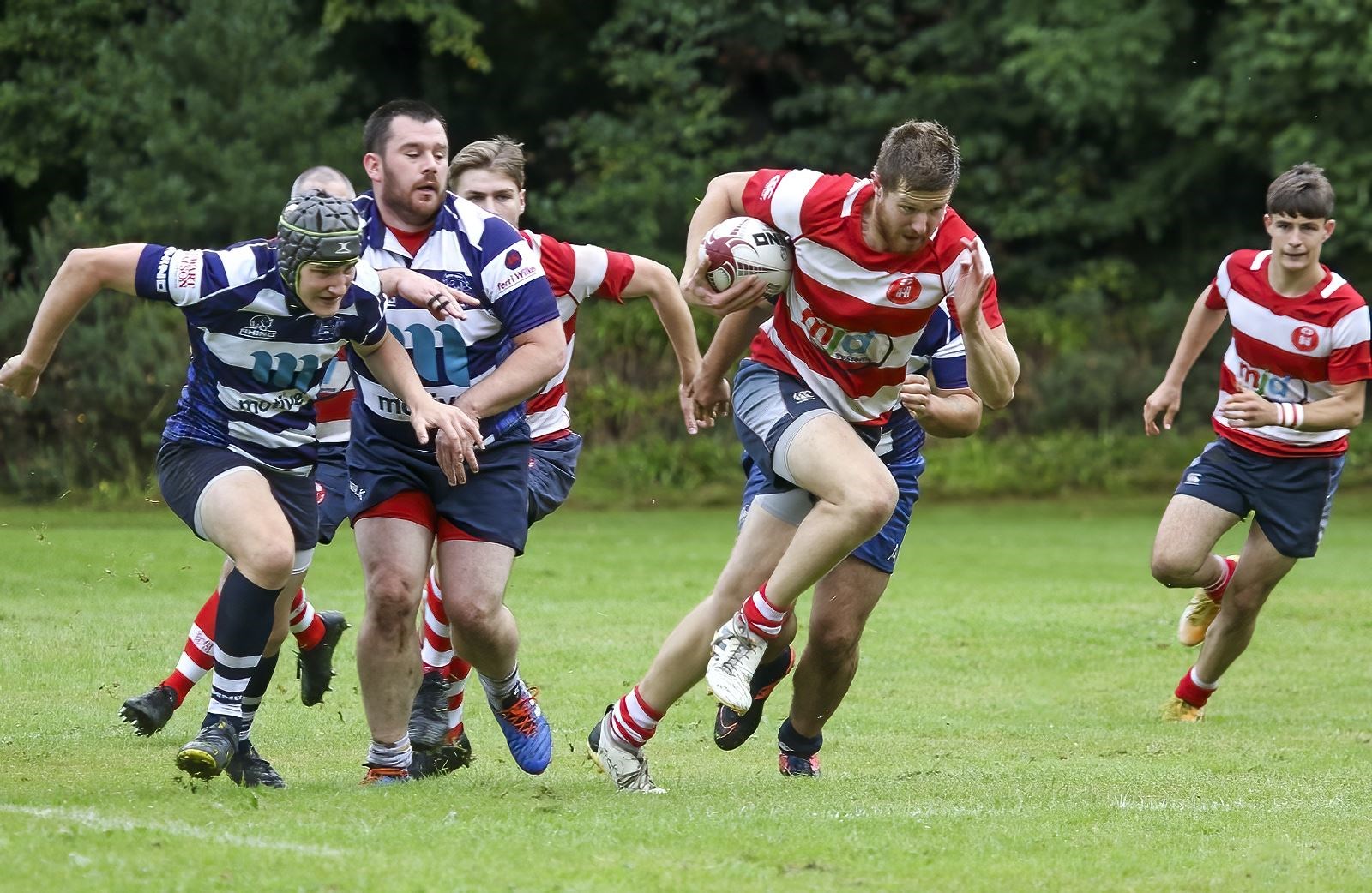 Stewart Bright breaks forward for Moray supported by Cameron Morrison Smith (left) and Rory Millar. Photo: John MacGregor