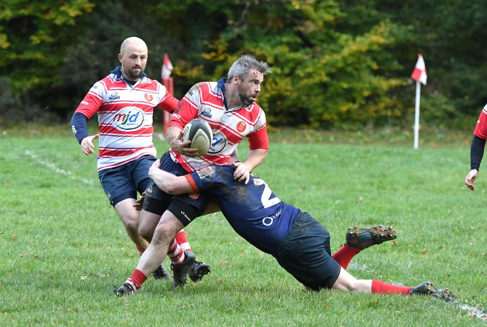 Chris Robottom looks to offload. In support is Rupert Holt. Photo: James Officer