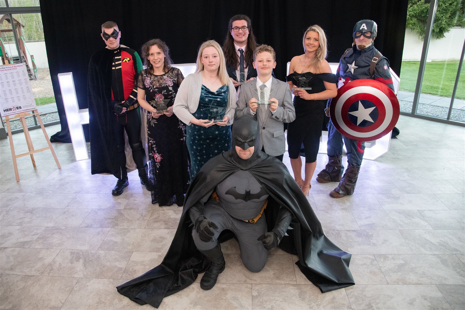 Award winners with the superheroes. Picture: Daniel Forsyth