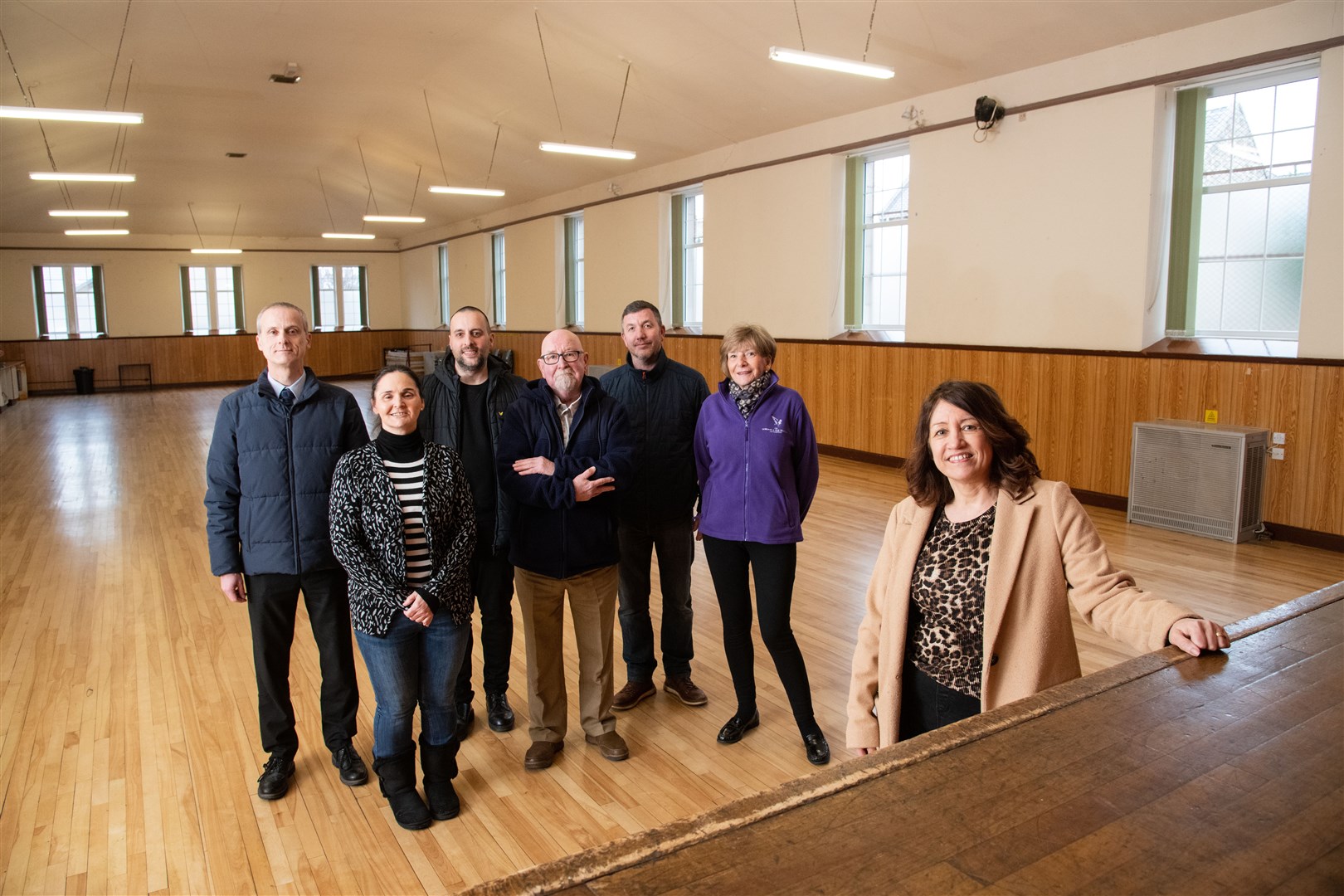 In the refurbished main hall, from left, Sandy Keith (Hall Trustee), Julie Lawrence (Bishopmill Mutual Improvement Association), Jérémie Fernandes (Local Councillor), Alex Gentleman (Bishopmill Mutual Improvement Association), Neil McAndrew (Moray Glass), Margaret Stenton (Gordon & Ena Baxter Foundation) and Lesley Williamson (Bishopmill Mutual Improvement Association). Picture: Daniel Forsyth