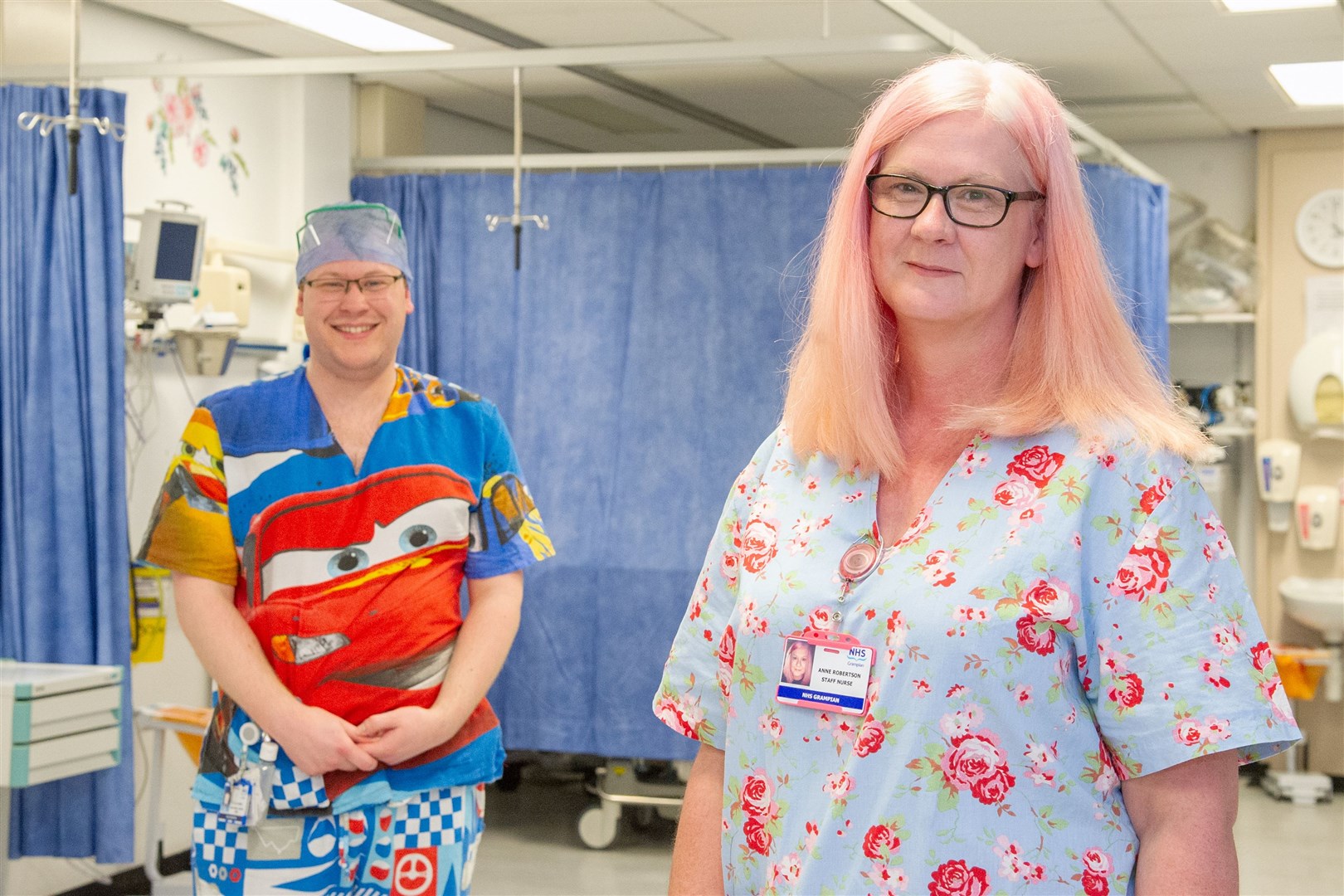 Dr Gray's Hospital theatre staff Daniel Wood and Anne Robertson wearing their work clothes made for them by Moray Scrubs volunteers. Picture: Daniel Forsyth.