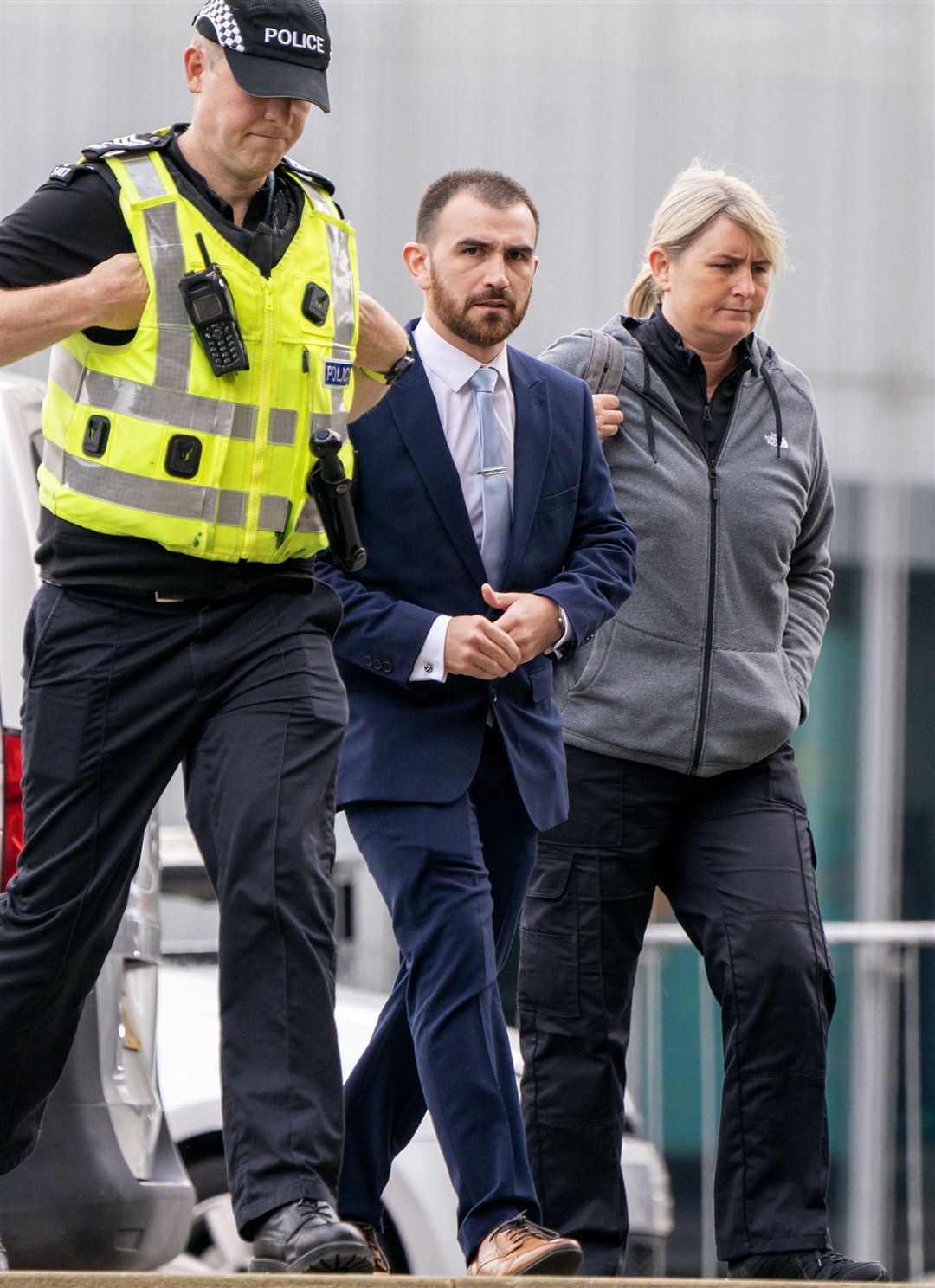 Pc James McDonough (centre) arrives at Capital House in Edinburgh for the public inquiry (Jane Barlow/PA)