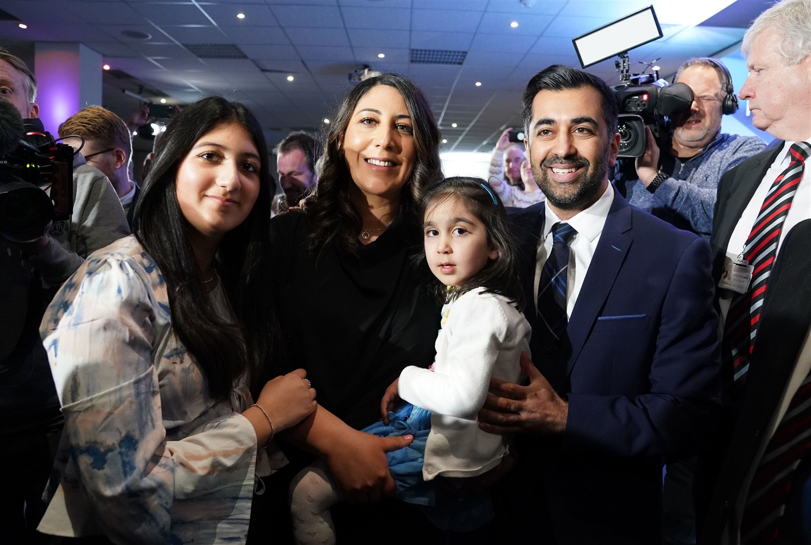 Humza Yousaf with his wife Nadia El-Nakla, young daughter Amal and step-daughter following the SNP leadership election (Andrew Milligan/PA)