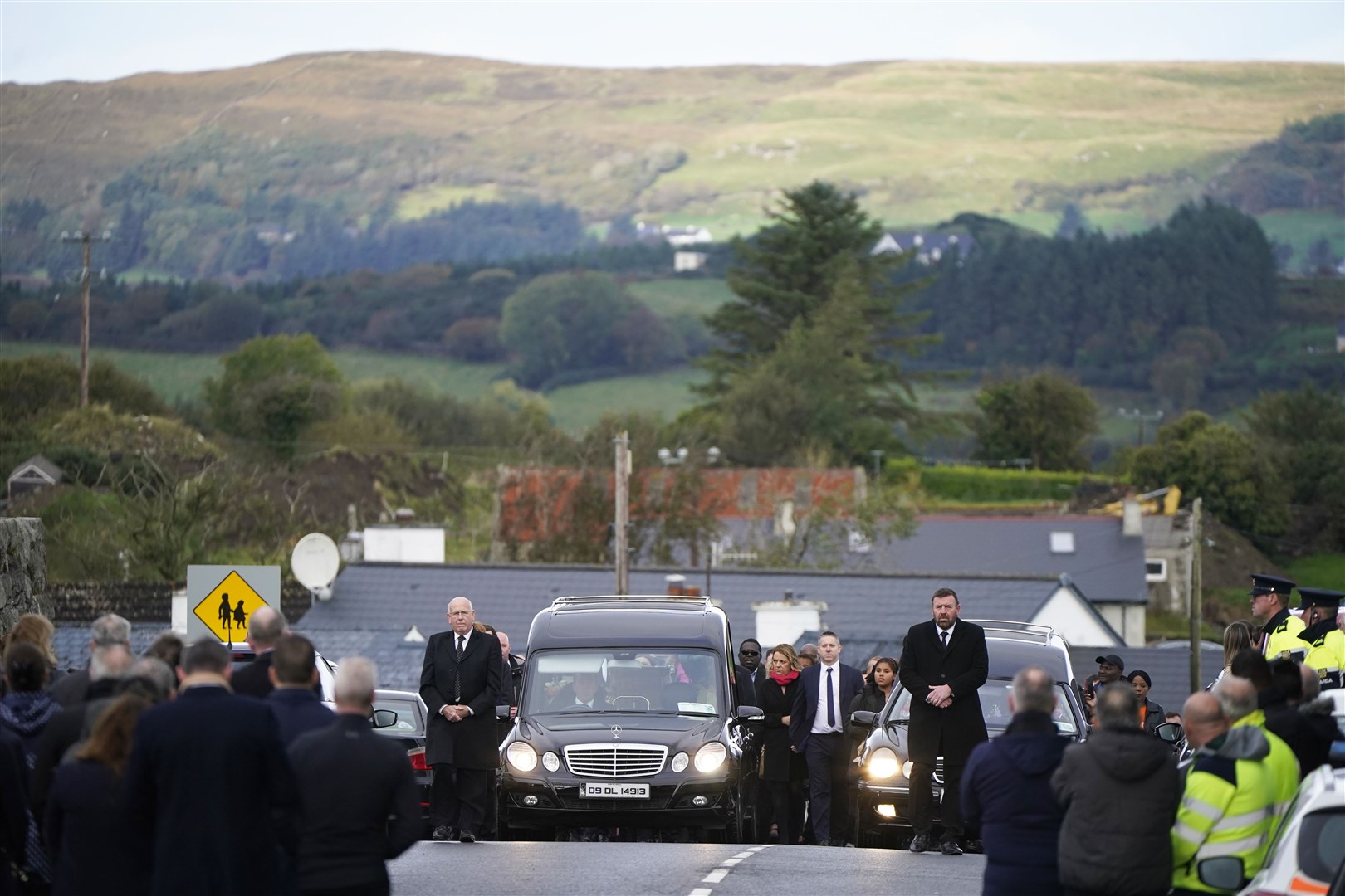 Family and mourners arrive at St Michael’s Church (Niall Carson/PA)