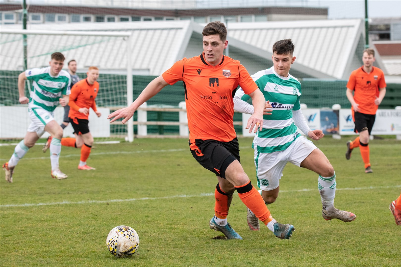 Rothes' Alan Pollock ahead of Buckie Thistle's Max Barry...Buckie Thistle FC (1) vs Rothes FC (1) - Highland Football League 22/23 - Victoria Park, Buckie 18/03/2023...Picture: Daniel Forsyth..