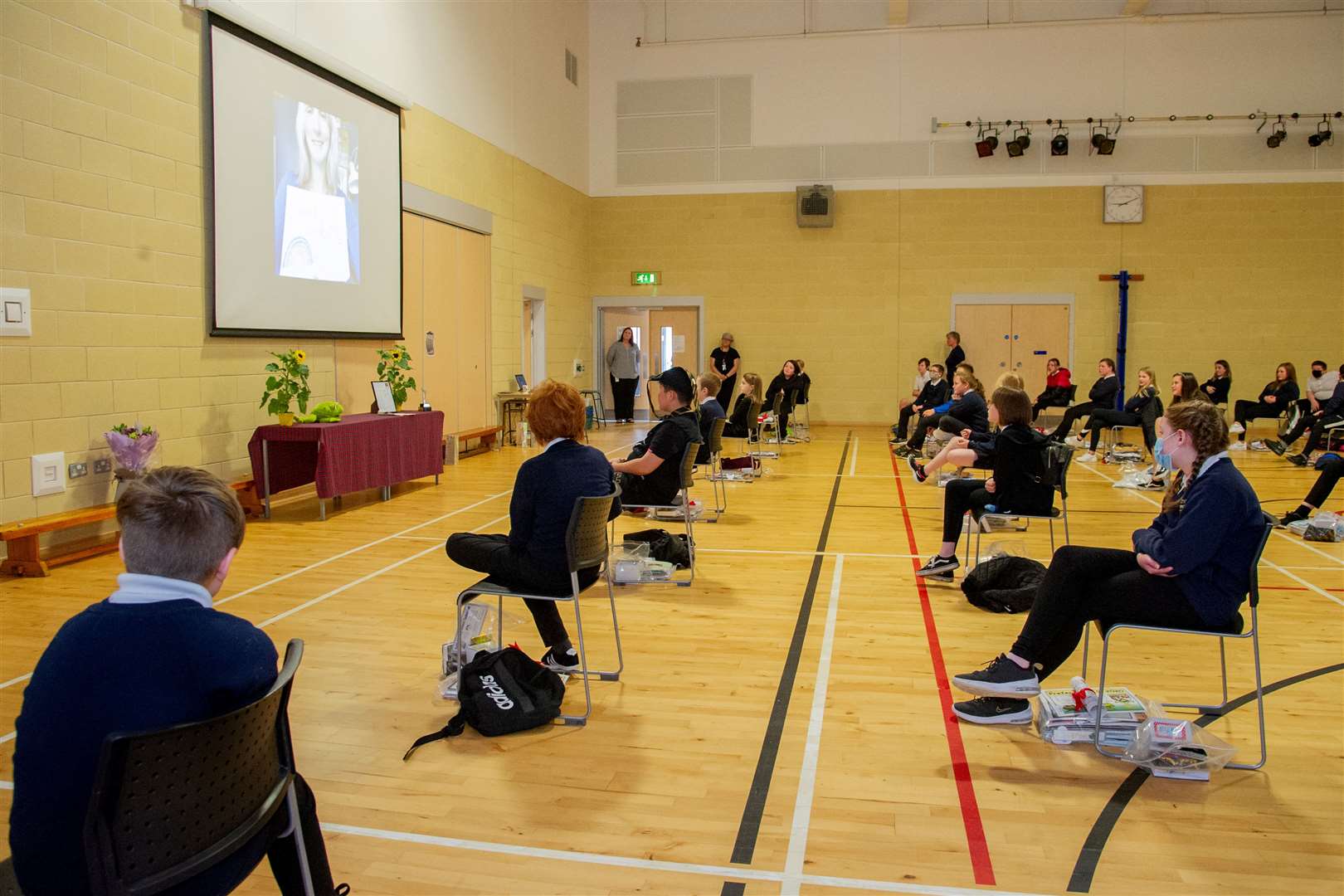 Keith Primary School held a socially distanced leavers assembly before teachers formed a guard of honour as the Primary Seven pupils were piped out of the school last year. The gym hall will be used as a mass Covid-19 vaccination centre on Friday. Picture: Daniel Forsyth..