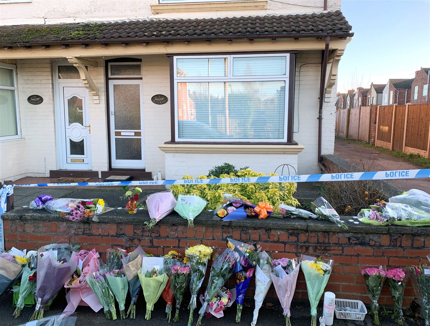 Flowers outside the family house on Station Road (Josh Payne/PA)