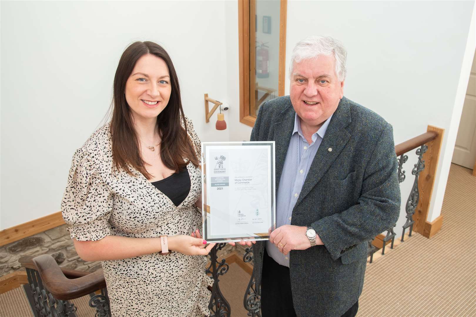 Roy McLellan presents Sarah Medcraf and Moray Chamber of Commerce with the Armed Forces Covenant Silver Award. ..Picture: Daniel Forsyth..