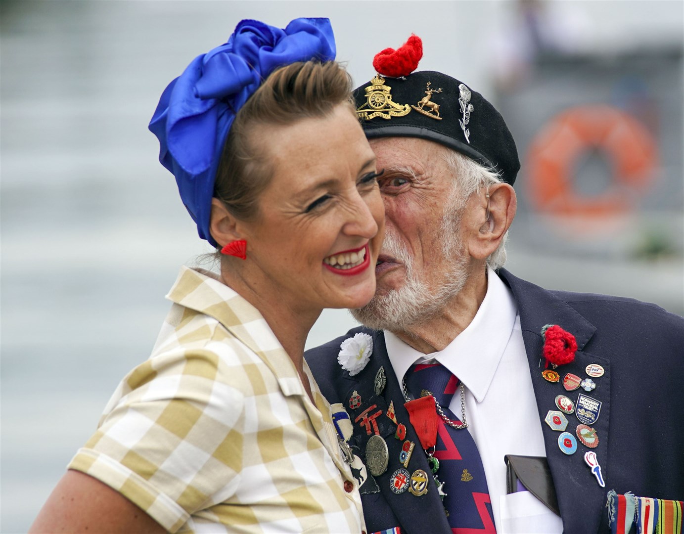 Joe Cattini kissing a member of the Charlalas on the day he and other veterans are welcomed to the Portsmouth Historic Dockyard to commemorate the 77th anniversary of the Normandy Landings (Steve Parsons/PA)