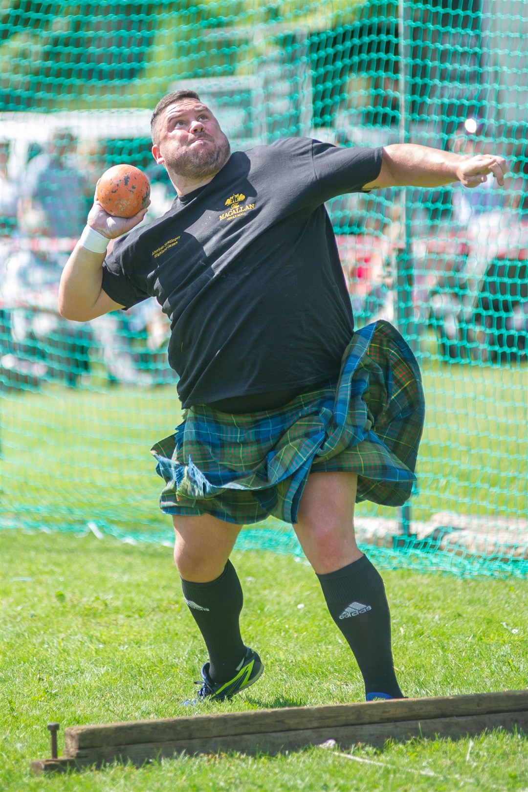 Throwing the 22lb shot is Sinclair Patience in the heavyweight category...The 76th Aberlour Stathspey Highland Games - 3rd August 2019. ..Picture: Daniel Forsyth. Image No.044579.