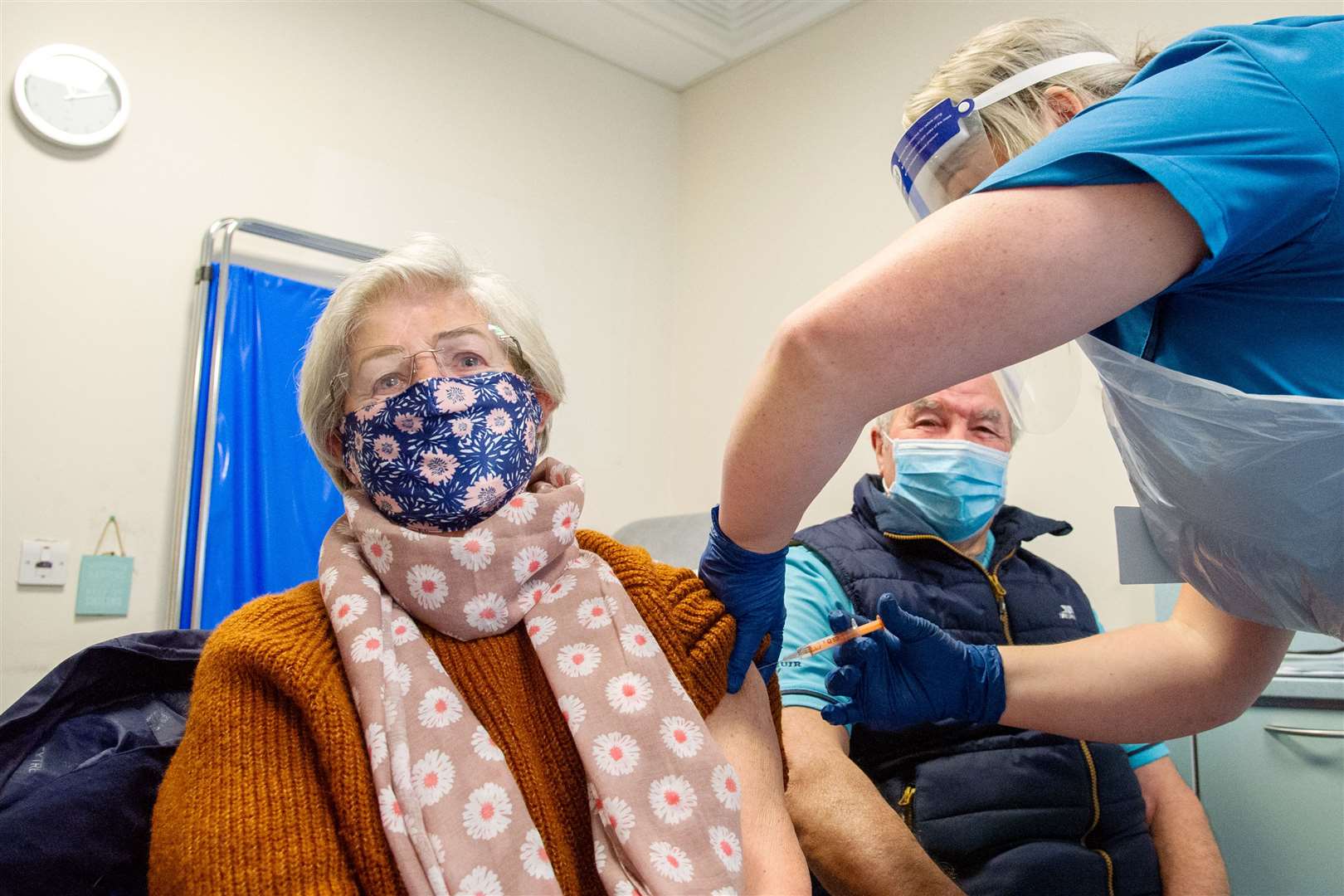 Jenny and Alex Stewart from Lossiemouth get vaccinated by Paula Broughton. Picture: Daniel Forsyth